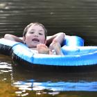 Remi Nicholson (5), of Dunedin, cools down at Outram Glen yesterday. PHOTO: CHRISTINE O'CONNOR