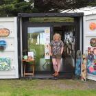 Invercargill artist Andrea Sexton at her Little Red Caboose gallery, which is a refurbished ship...