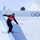 Finn Bilous performs a trick during the men’s freeski slopestyle qualification event yesterday at...