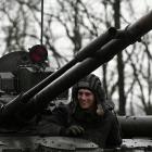 A Russian service member observes from a BMP-3 infantry fighting vehicle during drills held by...