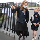 Te Rohuto Whio School principal Kate Morgan guides the first pupil Sophia Rollo, 8, through the...