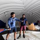 Otago Boys’ High School tennis coach Jaden Grinter (left) tests the potential of the new dome...