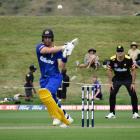 Otago batsman Anaru Kitchen plays a pull shot during his innings of 54 at the Super Smash double...