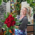 imply Flowers and Events owner Donna Hewer holds a bunch of roses ahead of Valentine's Day on...