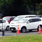 Drivers queue up to receive nasopharyngeal swabs to test for Covid-19 at Te Kaika’s drive-through...