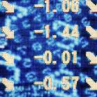 A screen depicting plummeting stocks. Photo by Reuters.