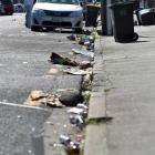 Litter lies strewn in Castle St yesterday, the debris of a night of revelry in the student...