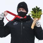 Wanaka-based para skiier Adam Hall poses with his bronze medal following the Para Alpine Skiing...