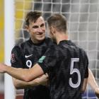 Chris Wood (left) celebrates his goal during the OFC 2022 FIFA World Cup qualifiers match between...