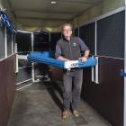 Standing inside the ninth and final Dunedin-built horse ambulance in a nationwide fleet is equine...