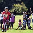 James Henare (7), of Portobello, leads the way as the community gears up for a new bicycle pump...