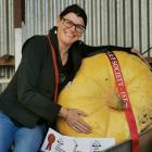 Donna Pettitt hugs her nearly 96kg entry which won the South Otago A&amp;P Show Giant Pumpkin...