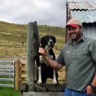 Patearoa Collie Club president Tim ‘‘Wolf’’ O’Neill pats his heading dog Ewe after they secured a...