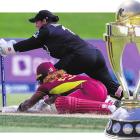 New Zealand’s Katey Martin attempts to run out Hayley Matthews, of the West Indies, as she...