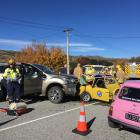 Emergency services attend a serious collision between a Morris Mini and a Ford Everest in the...