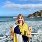 Helen Willis displays Straw the Line NZ’s edible straws at St Clair Beach, Dunedin. PHOTO: SUPPLIED