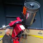 Dunedin Astronomical Society committee member Ashley Pennell works on the large telescope at the...