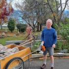 Julian Dart cleaning his local graveyard. Photo: RNZ / Rachel Graham