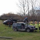 Emergency services work at the scene of a two-vehicle crash near Alexandra that left a woman...