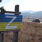 The letter Z added to a sign in the colours of Otago, and the Ukrainian flag, on State Highway 8...