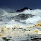 Big waves whip up the ocean off St Clair, with White Island in the background. Photo by Gerard O...