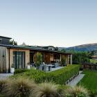 This Wanaka house overlooks the Mount Aspiring College playing fields, giving views of the...