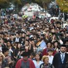 The University of Otago graduation parade makes it  way down George St in Dunedin on Saturday. It...
