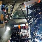 CCTV footage captured of the car ramming into the store, taking out a shelf of whiskey in the...