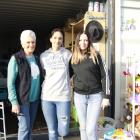 Hope Op Shop manager Dana George (centre) with volunteer Julie Gunby (left) and clothing manager...