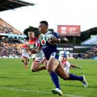 Ken Maumalo scores for the Warriors against the Knights this year. Photo: Getty Images
