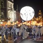 The Dunedin Midwinter Carnival procession approaches the Octagon from lower Stuart St last June....