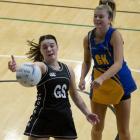Southern goal shoot Trinity Richardson-Dann tries to reel in a pass as Taieri goal keep Zharna...