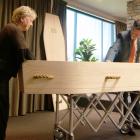 Affinity Funerals funeral directors Lynley Claridge and Gary Wybrow work on final preparations...