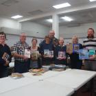 Sorting through books for this year’s Bookarama are (from left) Jacquie Webby, Stewart Anderson,...