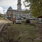 Contractors for the Dunedin City Council start work yesterday to replace turf in the Octagon that...