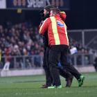 A Red Badge security guard walks a pitch invader off the field at an All Blacks test at Forsyth...