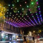 Rainbow lights glow, festooned in the dark over a section of George St early yesterday as part of...
