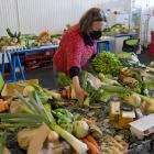 Rose Newburn packs a box of fresh produce at the Locavore workshop. PHOTO: GERARD O’BRIEN