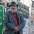 Invercargill mayoral candidate Noel Peterson stands in front of the new CBD development, which...