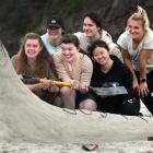 At a sandcastle building contest at Tomahawk Beach yesterday afternoon, Steven the sustainability...