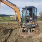 Papakura High School pupil Pounamu Henare-Arona (17) operates a digger in West Otago. PHOTOS:...