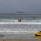 Surf lifesavers using jet skis and inflatable rigid boats are put through their paces at...