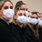 Captain Gina Crampton (second from left) and her Silver Ferns line up for official photographs in...