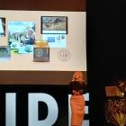 Entrepreneur Justine Ross addresses the crowd at South Island Dairy Event, watched by her husband...
