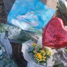 Flowers left at the scene of the crash near Timaru last August. Photo: RNZ 