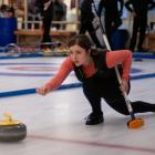 Ariel Webber, of Auckland, releases her stone during a match at the New Zealand Curling...