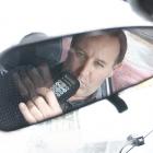 Gavin Foster blows into one of the alcohol interlocks his company installs in the vehicles of...