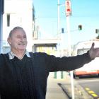 Embracing an adjusted bus stop in King Edward St, South Dunedin, yesterday is Dunedin Tramways...