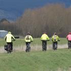 Riding on a stopbank beside Silver Stream near Mosgiel yesterday are members of the AOK Shark...