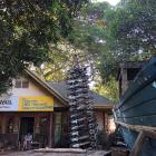Bobby Chan and his chainsaw tower. A confiscated boat stands to the right.PHOTOS: KARL MALAKUNAS